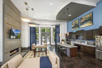 A modern living room with a fireplace and a television.